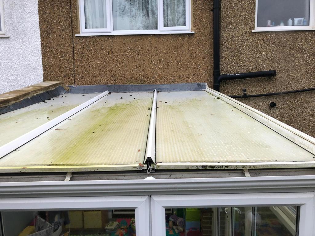 Dirty polycarbonate conservatory roof panels before cleaning
